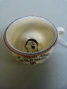 A miniature chamber pot with a picture of Hitler on the inside, marked " Flip your ashes on old