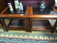 A pair of glass topped coffee tables
