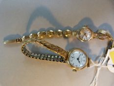 Two ladies 9 ct gold wristwatches, one with gold strap. (Zenith & Roamer)