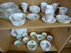 A Crown Staffordshire part tea service and one other two shelves