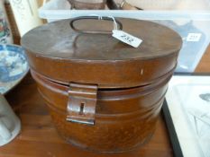 An antique tin hat box