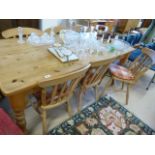 A large pine farmhouse dining table and six chairs