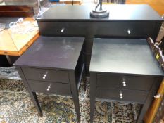 A Black and chrome chest of drawers with two matching bedsides