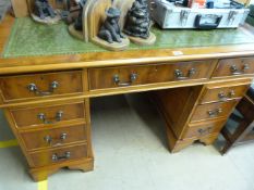 A Yew Wood kneehole desk with leather insert
