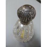 A hallmarked silver topped scent bottle