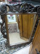 A mirror with Black Forest style carving