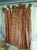 A large quantity of lined red curtains with gold detailing