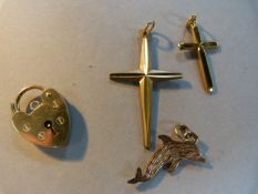 9 ct gold padlock, two crosses and a dolphin pendant, total weight 6.2g