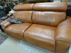 A Tan leather two seater sofa