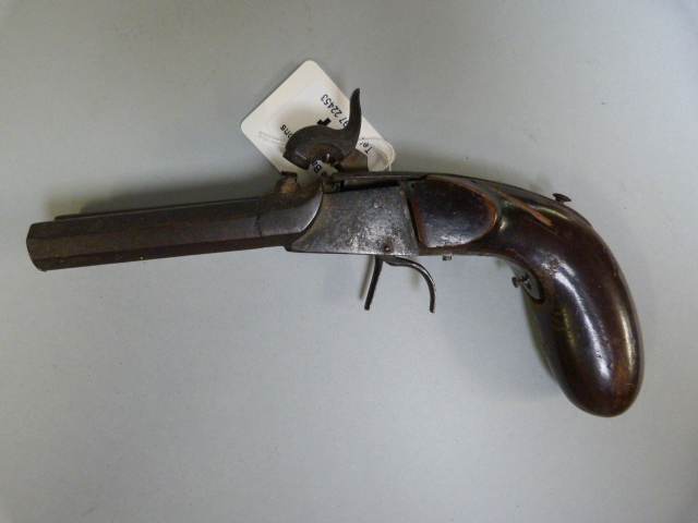 A double barrelled flintlock pistol- damage to stock