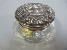 A hallmarked silver topped dressing table pot