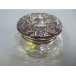 A hallmarked silver topped dressing table pot