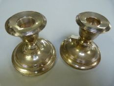 A pair of hallmarked silver candlesticks