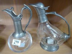 Two pewter topped decanters, one in the form of a duck
