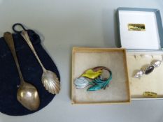 A Silver and enamelled brooch, two others and two silver teaspoons