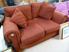 A red upholstered sofa