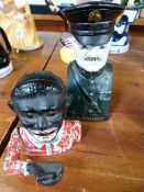 A cast iron "Jolly man" money box, and a U.S military figure money box "Pershing"