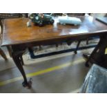 A Mahogany centre table on cabriole legs