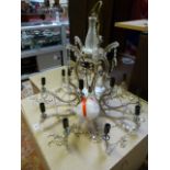 A large glass ten branch candelabra with cut glass drops