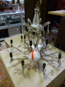 A large glass ten branch candelabra with cut glass drops