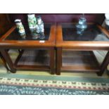 A pair of glass topped coffee tables