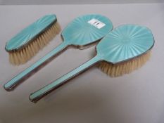 A hallmarked silver and pale green enamelled dressing table set comprising of mirror and two