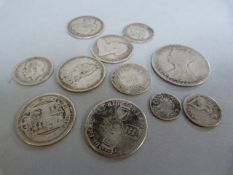 A Victoria Godless Florin ( very worn) a selection of Victorian silver coins, a William III shilling