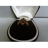 An amethyst cluster ring set in 9 ct gold- size L, total weight 3.8g