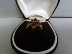 An amethyst cluster ring set in 9 ct gold- size L, total weight 3.8g