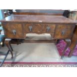 A small mahogany dressing table on cabriole legs