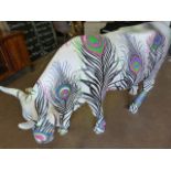 A life size fibreglass model of a cow, painted by Matthew Williamson- this cow was part of the Cow
