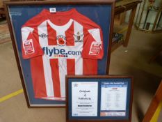 A framed and signed Danny Seabourne Exeter City football shirt and certificate of authenticity