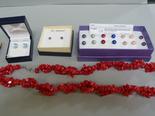 A Red coral necklace, 9ct gold amethyst earrings, silver and blue topaz earrings and a set of