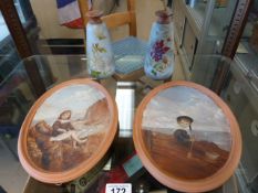 A pair of oil painted Terracotta plaques marked C.M - Torquay ware and two matching vases