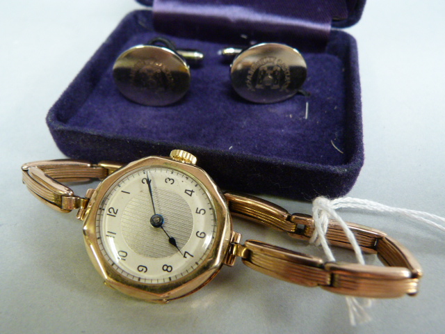 A ladies 9ct gold hallmarked wristwatch on an expanding strap (slight damage to hinge) along with