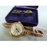 A ladies 9ct gold hallmarked wristwatch on an expanding strap (slight damage to hinge) along with