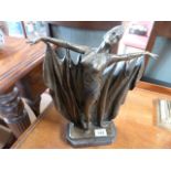 An Art Deco style bronze of a lady with arms outstretched