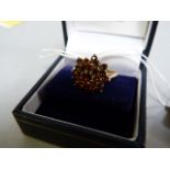 A 9ct gold and garnet cluster ring