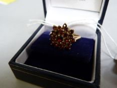 A 9ct gold and garnet cluster ring