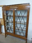 An Edwardian inlaid display cabinet