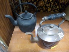 A cast iron kettle and a copper kettle