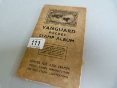 A vanguard stamp album with a small quantity of stamps