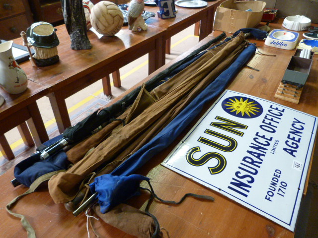 A quantity of various fishing rods including a split cane rod