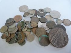 A quantity of various coins, British and American and a "Lusitania" medal