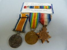 A set of three WWI medals awarded to 122 Private R Allan of the Gordon Highlanders and a 1914 Mons