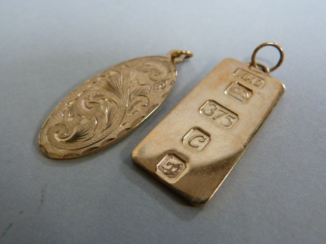 A 9ct gold ingot pendant and one other 9 ct pendant- total weight 13.2g