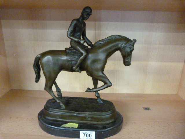 A bronze model of a horse and rider