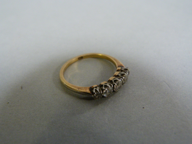 An 18ct Gold diamond 5 stone ring size M