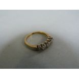 An 18ct Gold diamond 5 stone ring size M