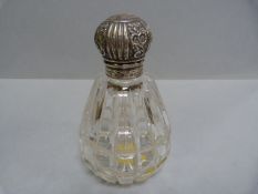 A hallmarked silver topped scent bottle